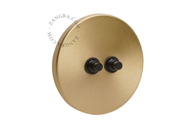 Brass switch with 2 black pushbuttons.