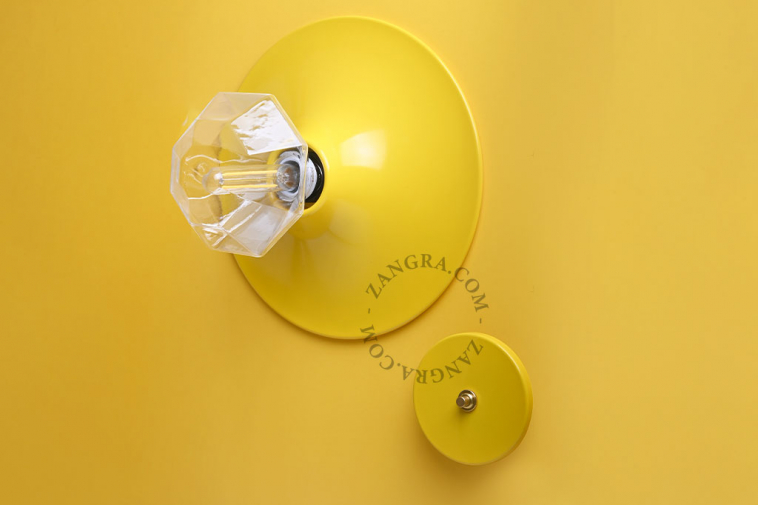round yellow wall or ceiling light