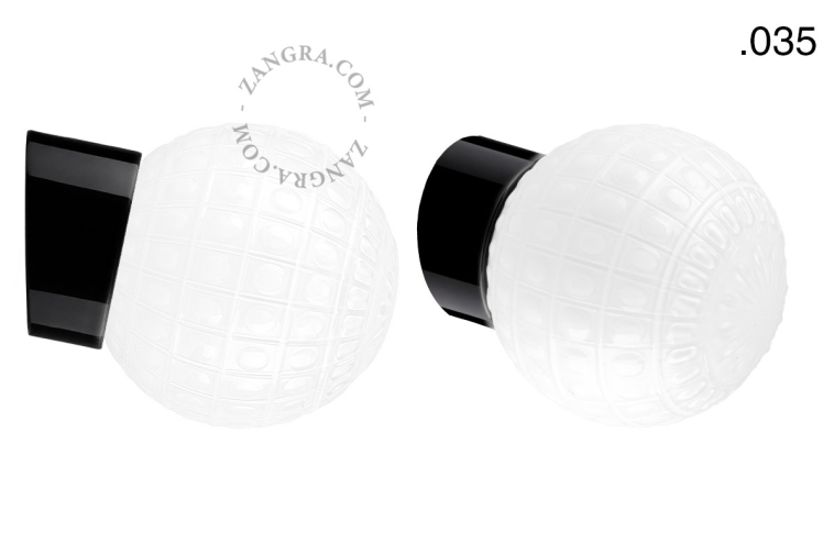Black porcelain wall light with glass lampshade.