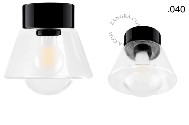 Zwarte porseleinen lamp met glazen schroefkap.