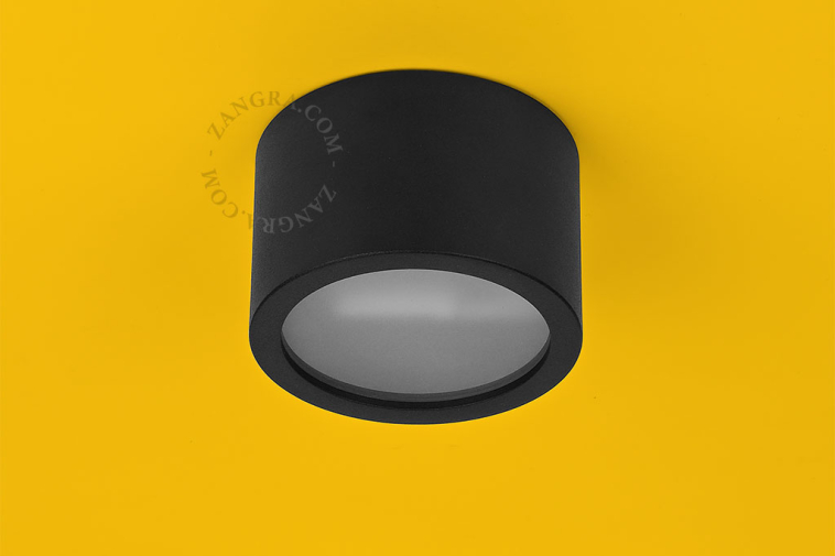 Surface-mounted spotlights for outdoor lighting.