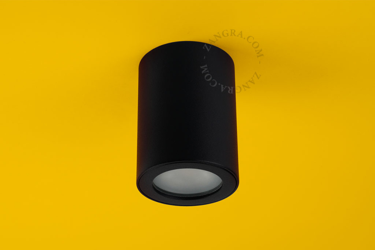 Cylindrical surface-mounted spotlight.