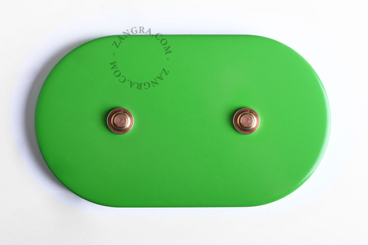 Oval green double pushbutton in brass.