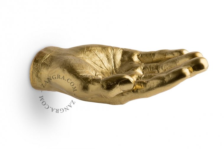 Hand-shaped golden trinket bowl.