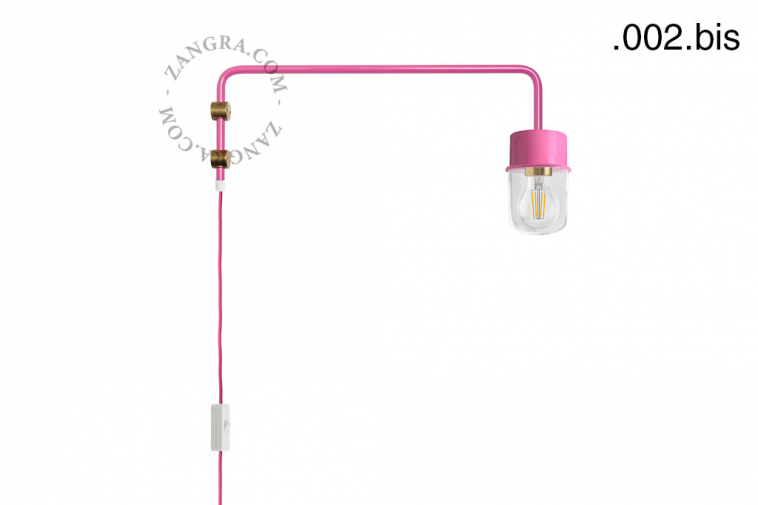 Pink wall lamp with swing arm.