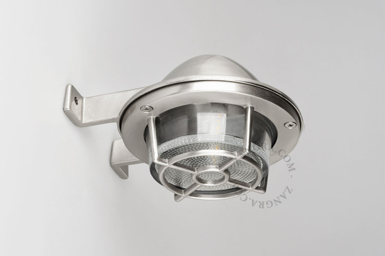 Marine-style silvery wall light.