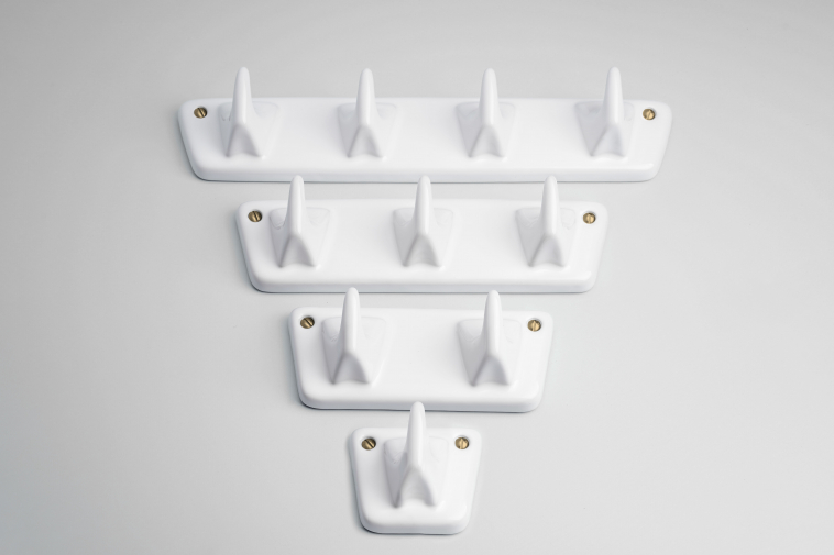 White porcelain coat hanger with 4 hooks.