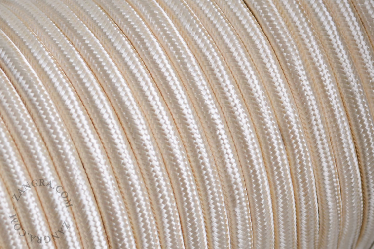 Ivory-coloured fabric cable.