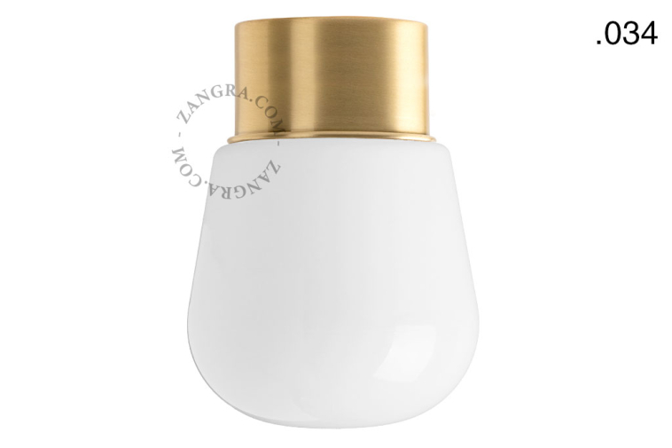 Brass ceiling light with glass shade.