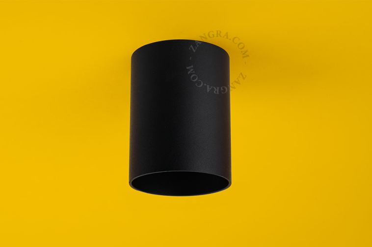 Surface-mounted cylindrical spotlight.