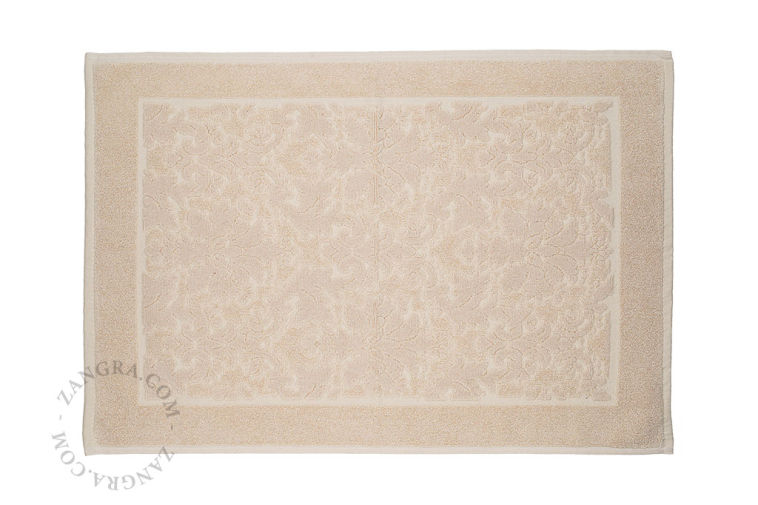 Light brown cotton bathroom mat.