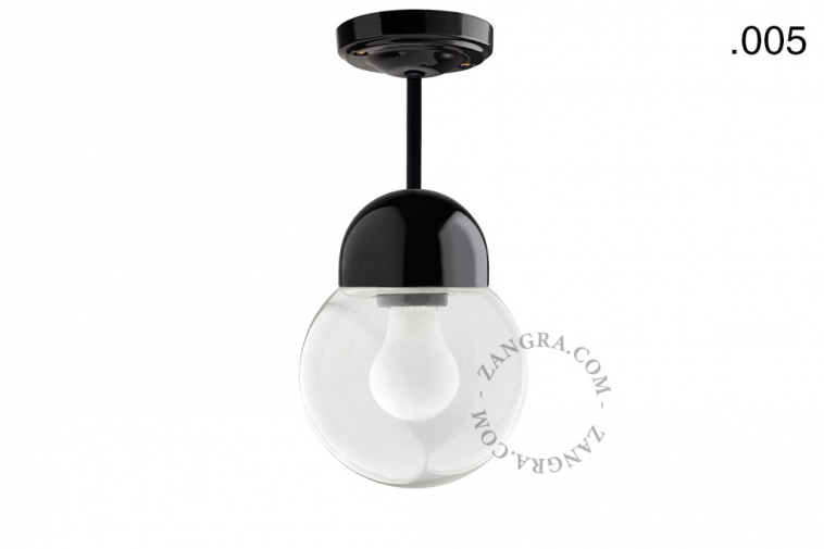 Black porcelain ceiling light with glass shade.