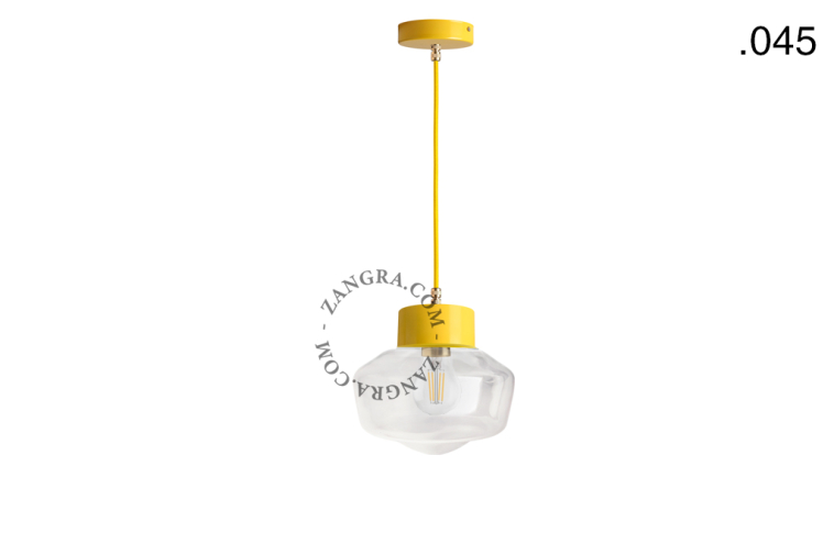 Yellow pendant light with glass shade.