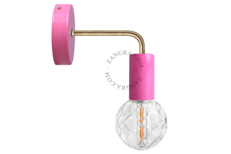 pink wall light with brass arm
