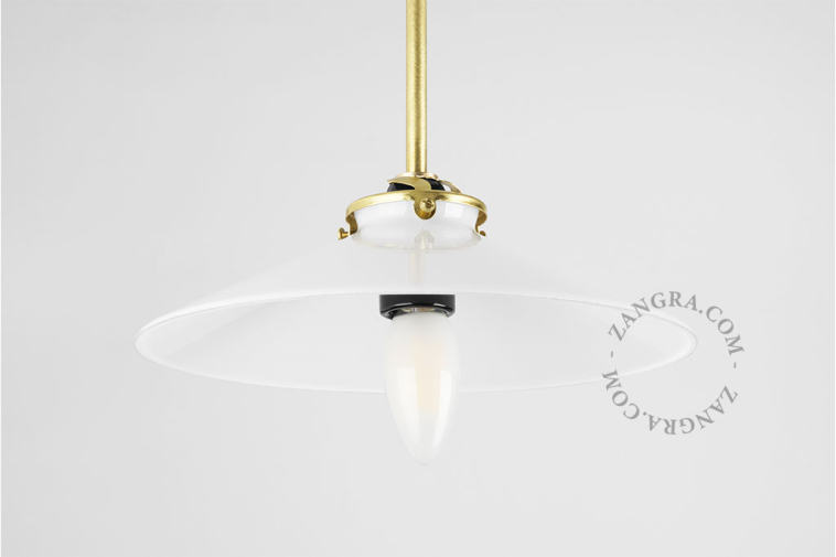 pendant light with opal glass shade and brass arm