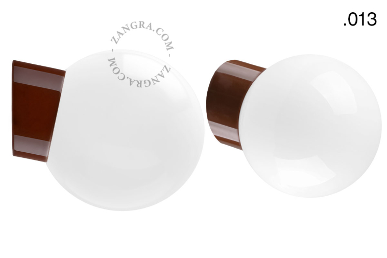 Brown porcelain wall light with glass lampshade.
