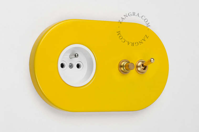 yellow flush mount outlet & two-way or simple switch – raw brass toggle & pushbutton