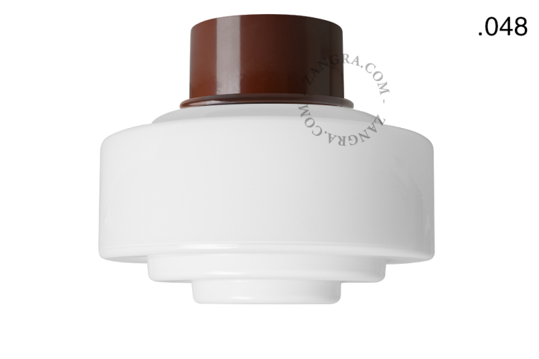 Brown retro ceiling light with glass shade.