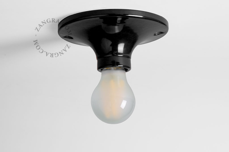 Black porcelain round light fixture.