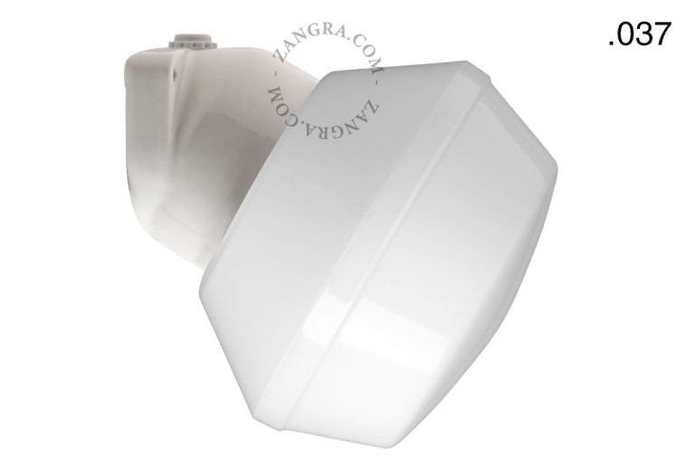 White porcelain wall light with glass globe for bathroom or outdoor use.