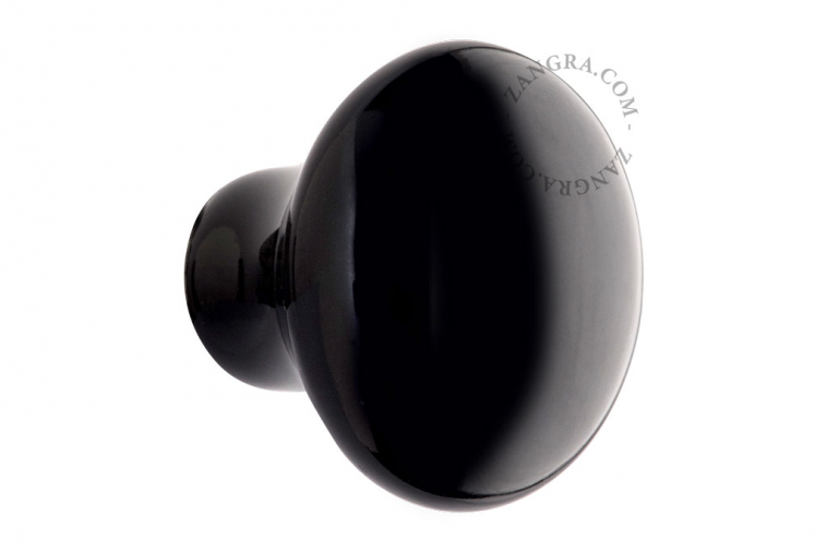 Round black porcelain drawer knob.