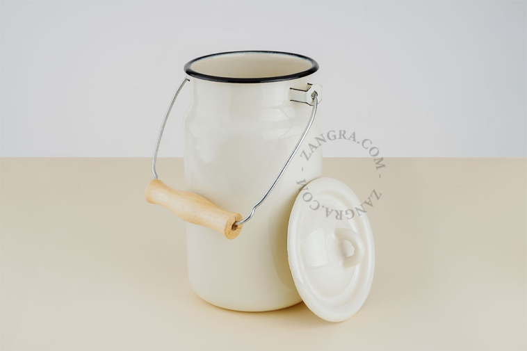 Ivory enamel compost bin with wooden handle.