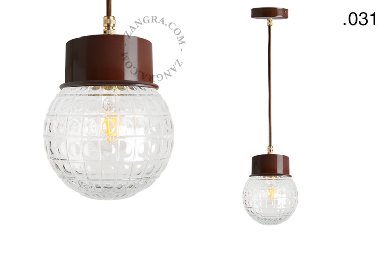 Brown pendant light with glass shade.