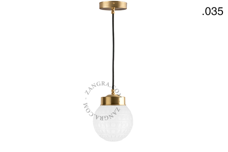 Brass pendant light with glass shade.