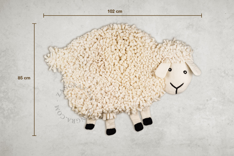 Sheep-shaped felt rug.