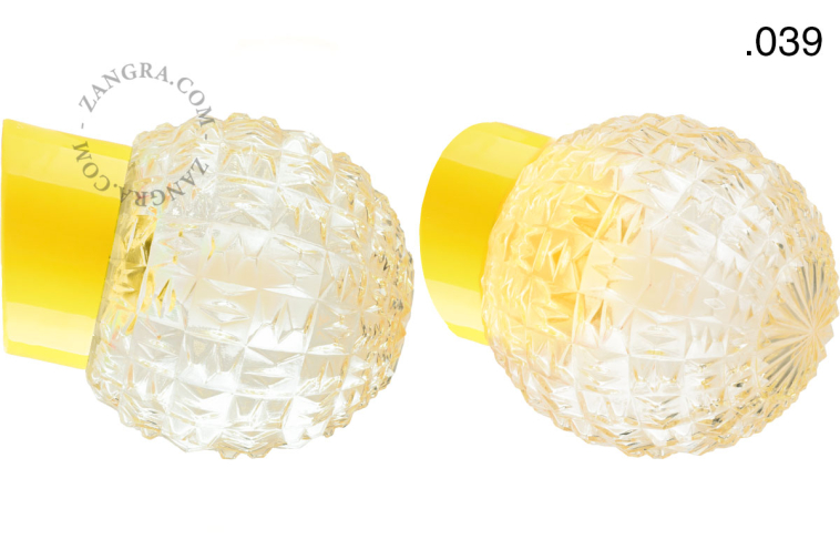 Yellow porcelain wall light with glass lampshade.