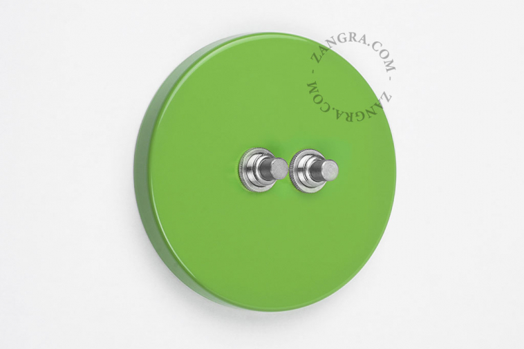 Round green double pushbutton.