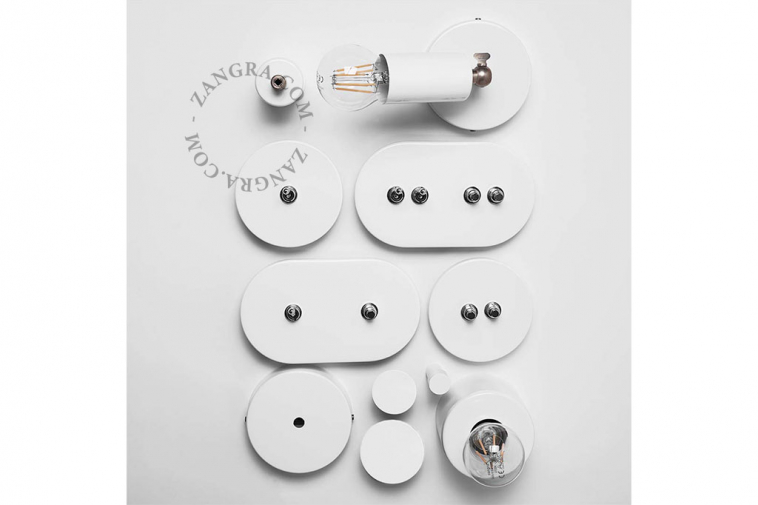 White round light switch with nickel toggle