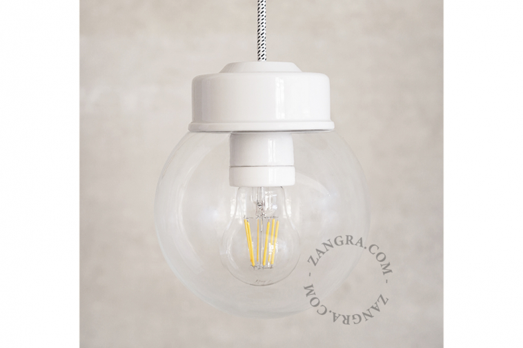 White porcelain pendant light with glass shade.