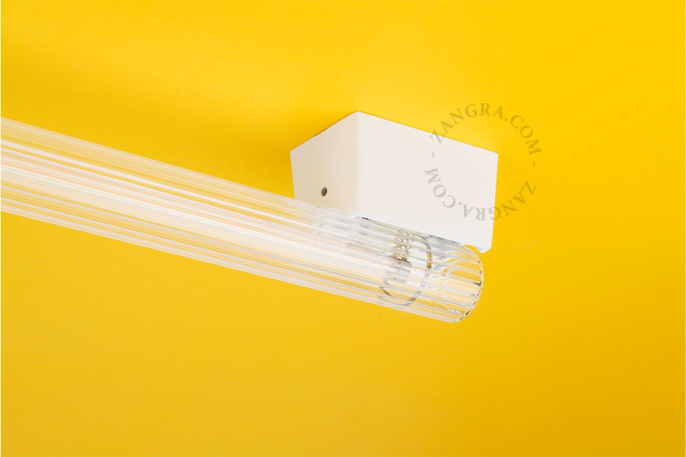 One-metre-long tube lamp with ribbed glass.