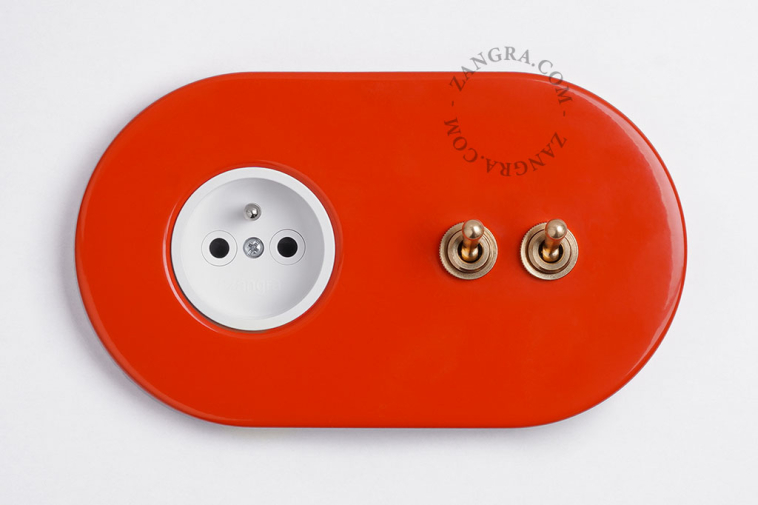 red flush mount outlet & two-way or simple switch – double raw brass toggle