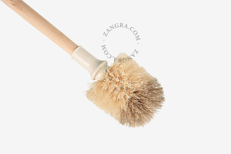 Porte-brosse de toilette en porcelaine blanche.