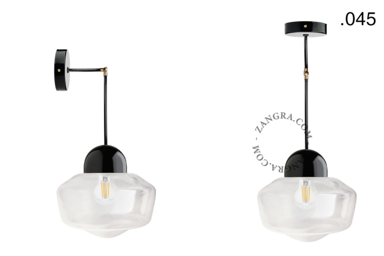 Black porcelain wall or ceiling light with glass shade.