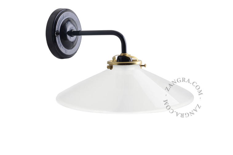 Black wall light with opaline glass shade.