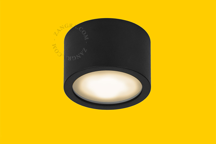 Surface-mounted spotlights for outdoor lighting.