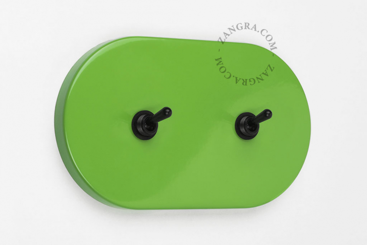 Oval green light switch with 2 toggles.