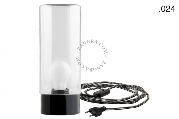 Black porcelain table lamp with glass shade.