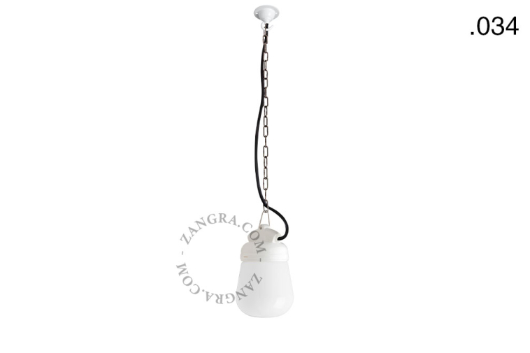 White porcelain pendant light with glass globe.
