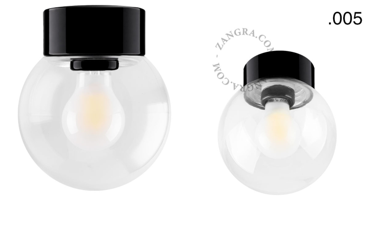 Zwarte porseleinen lamp met glazen schroefkap.