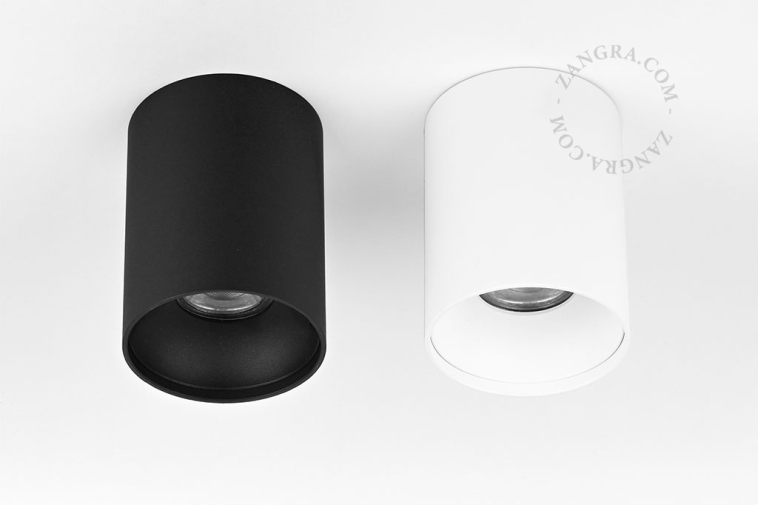 Surface-mounted cylindrical spotlight.