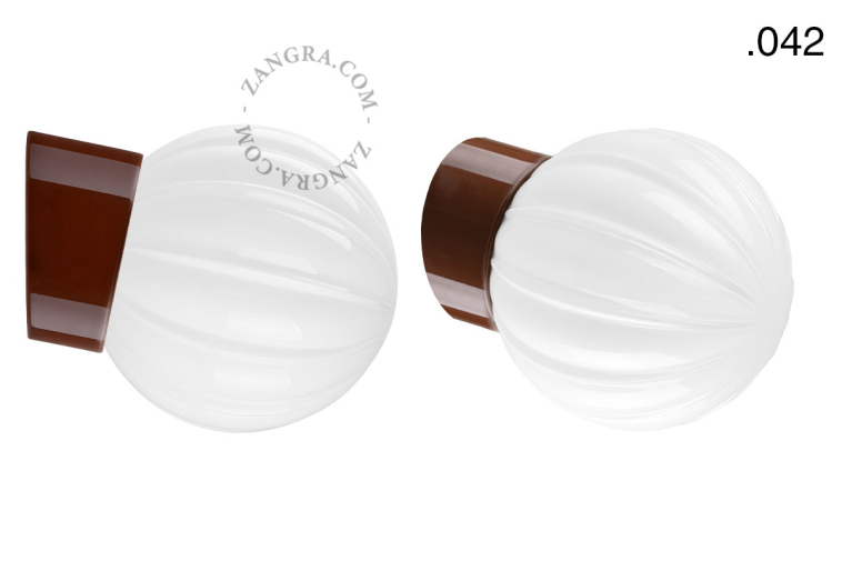Brown porcelain wall light with glass lampshade.