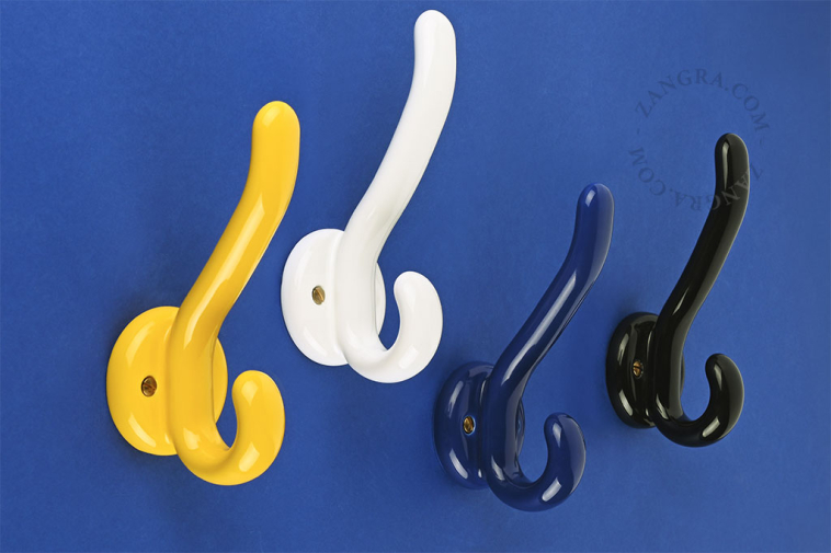 Yellow porcelain double coat hook.