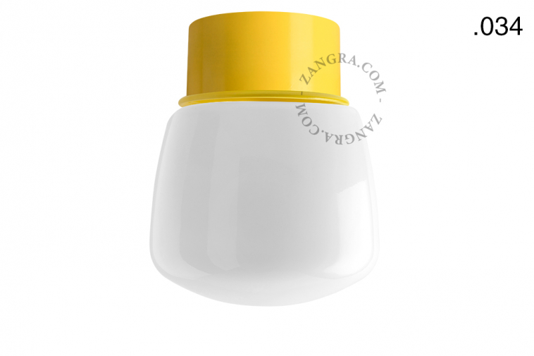 Yellow ceiling light with glass shade.