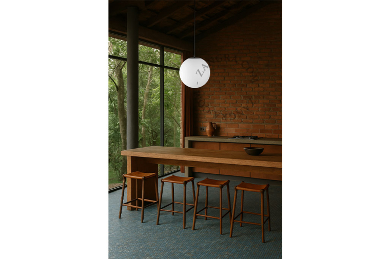 Pendant light with frosted glass lampshade.