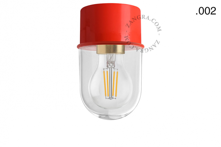 Red ceiling light with glass shade.