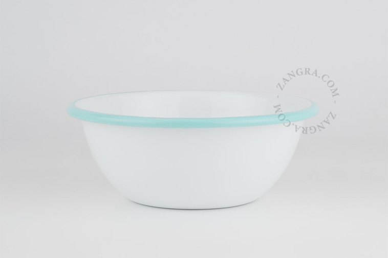 White enamel bowl with light blue rim.